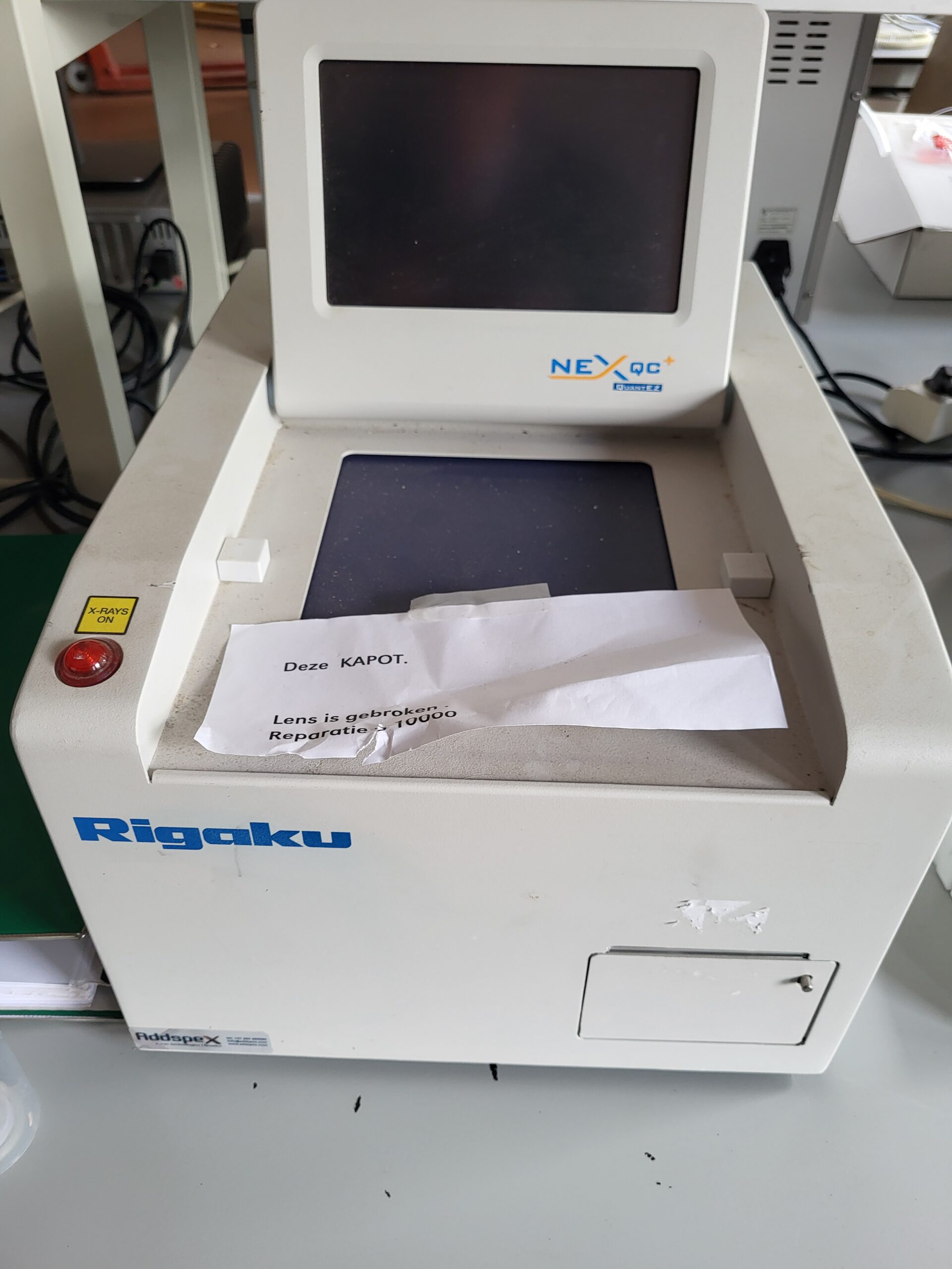 Used Rigaku NEX QC+ EZ EDXRF Analyzer from 2020 for parts/repair, supplied with PF-32-500 XRF sample films, cup accessories and cables as pictured.